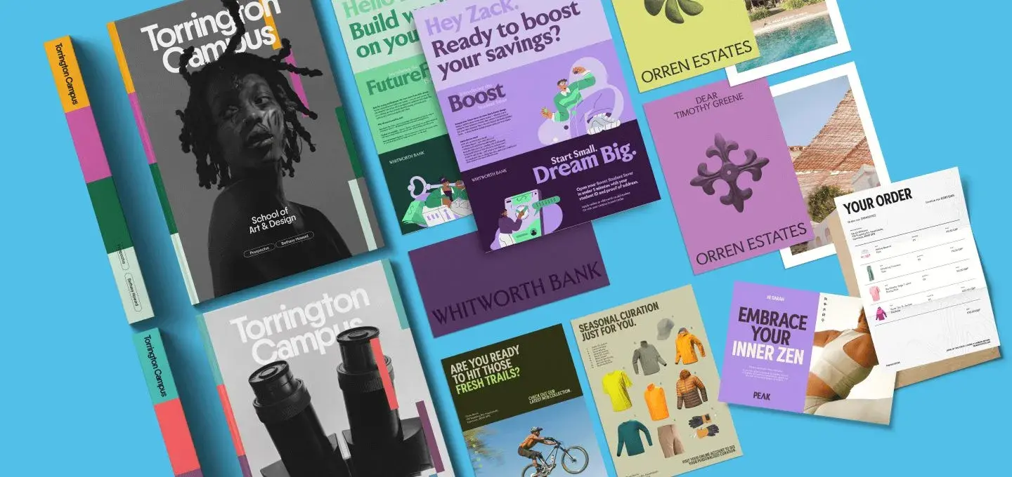 A vibrant collection of diverse brochures and booklets spreads across a light blue background. The materials feature varied designs, colors, and themes, including finance, lifestyle, education, and real estate. Each piece showcases creative layouts with text and images, evoking an energetic and modern tone.