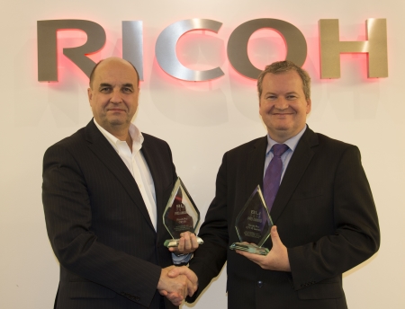 Benoit Chatelard, Vice President, Production Printing at Ricoh Europe receives an award from David Sweetnam, Head of EMEA Research and Lab Services at BLI.