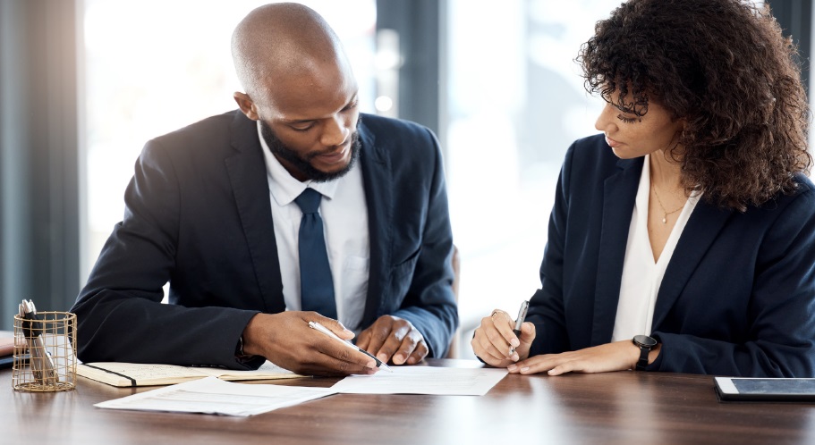 A person and person signing papers