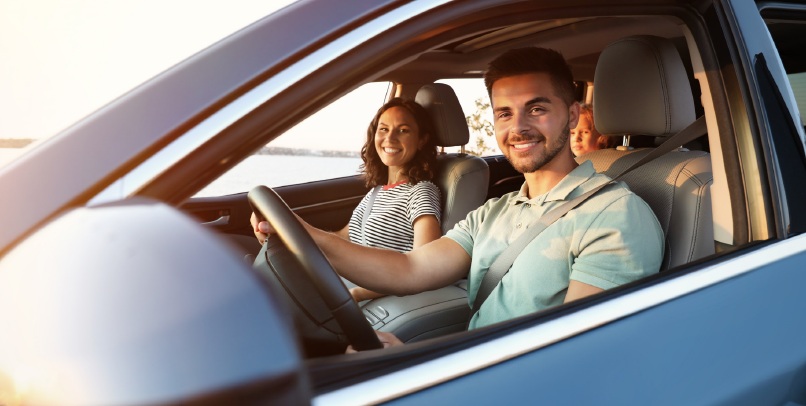 People travelling comfortably in a modern car, highlighting a smooth, safe and connected driving experience.