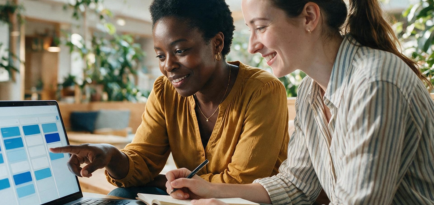 Professionals collaborating on cybersecurity strategy and Microsoft 365 security controls using a laptop in a modern office