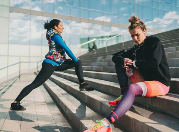 Nike Sportswear - women stretching