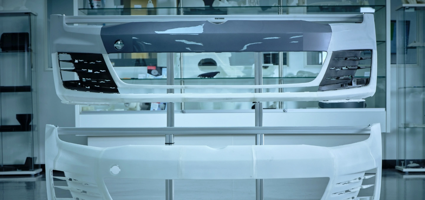 Two 3D-printed car bumpers in the AM Showroom.