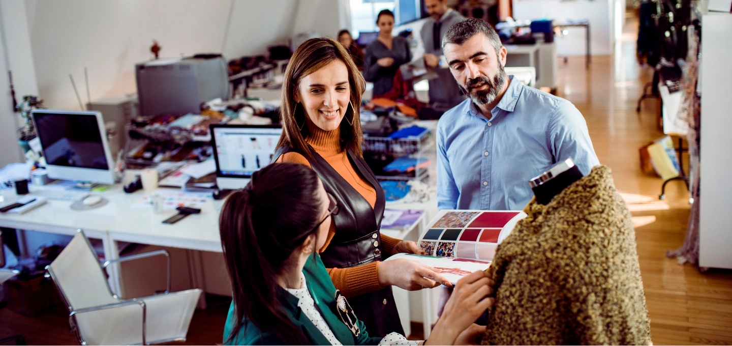 Colleagues discussing product materials and options for textile printing.
